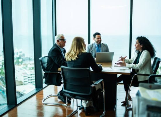 Coworkers talking on business meeting on office